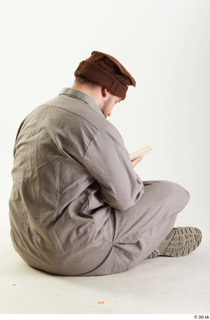 Luis Donovan Afgan Reading Book reading sitting whole body 0003.jpg